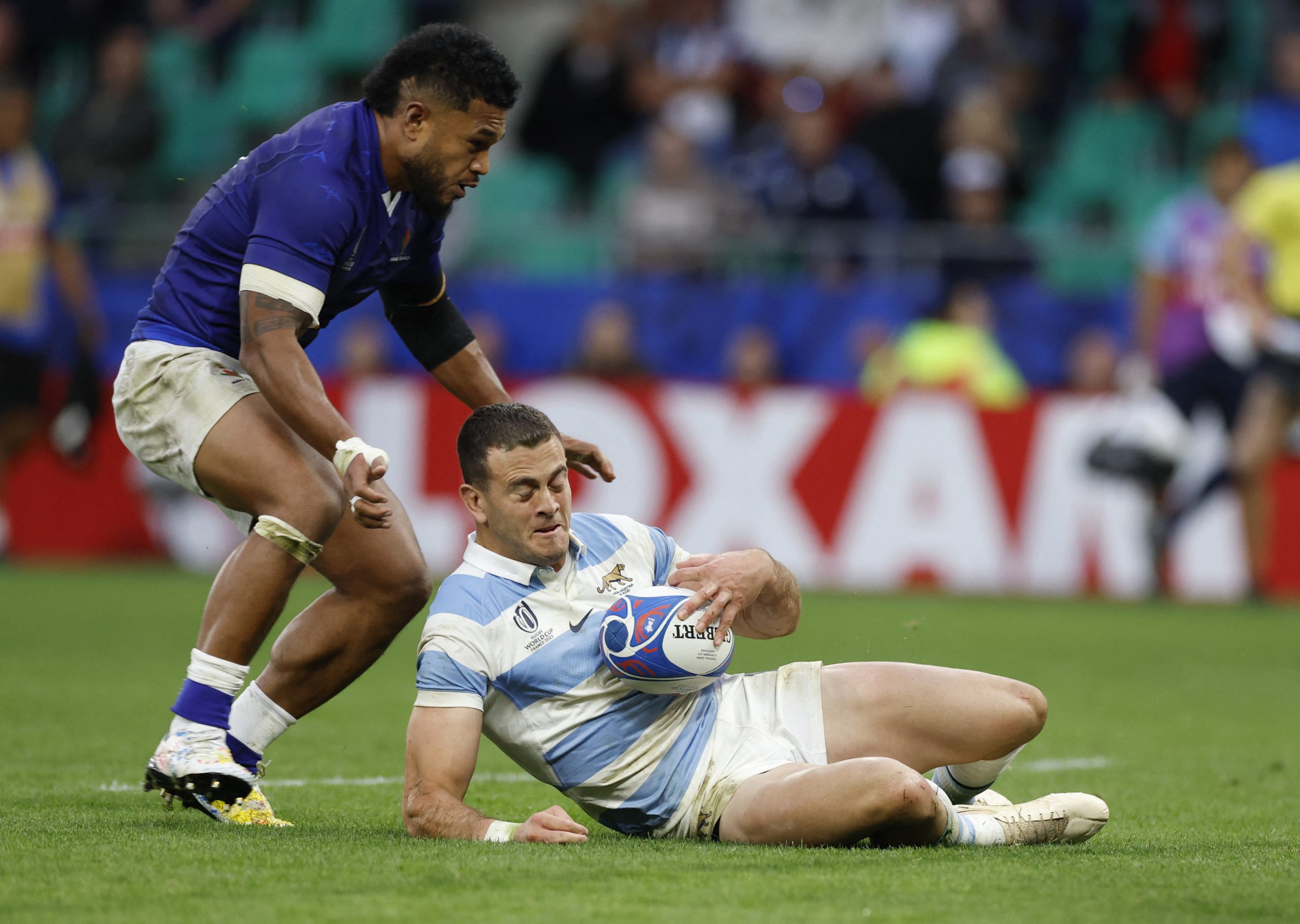 Rugby Union - Rugby World Cup 2023 - Pool D - Argentina v Samoa - Stade Geoffroy-Guichard, Saint-Etienne, France - September 22, 2023 Samoa's Tumua Manu in action with Argentina's Emiliano Boffelli 