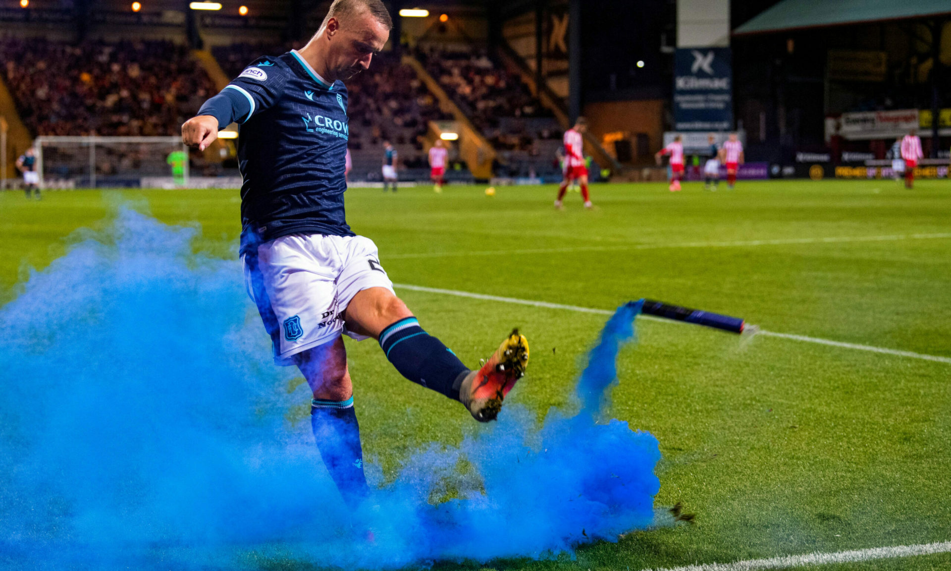 Leigh Griffiths kicking smoke bomb back at audience