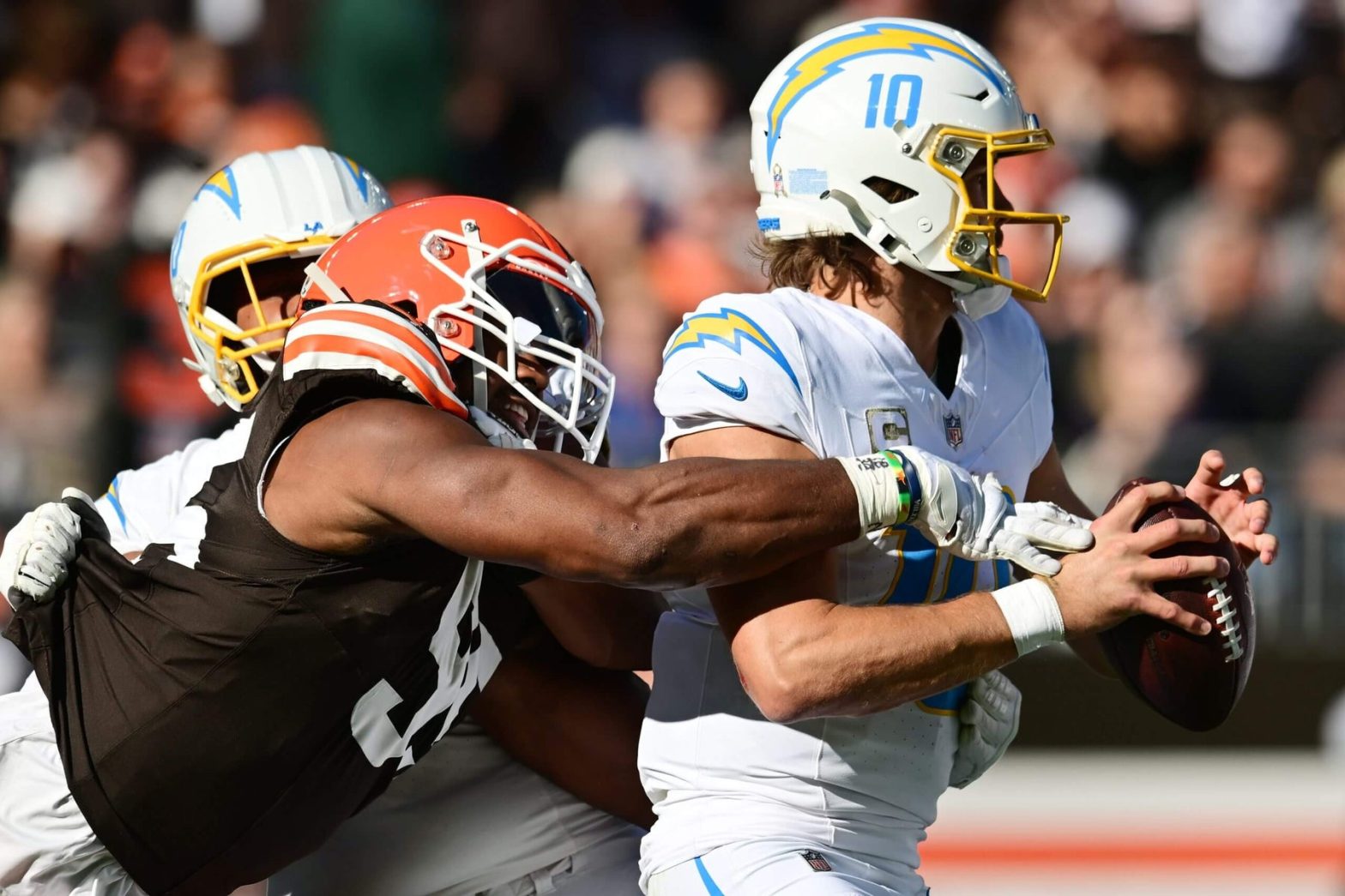 Chargers Coach Jim Harbaugh Calls for Better Protection for Justin Herbert Amid Missed Roughing Calls