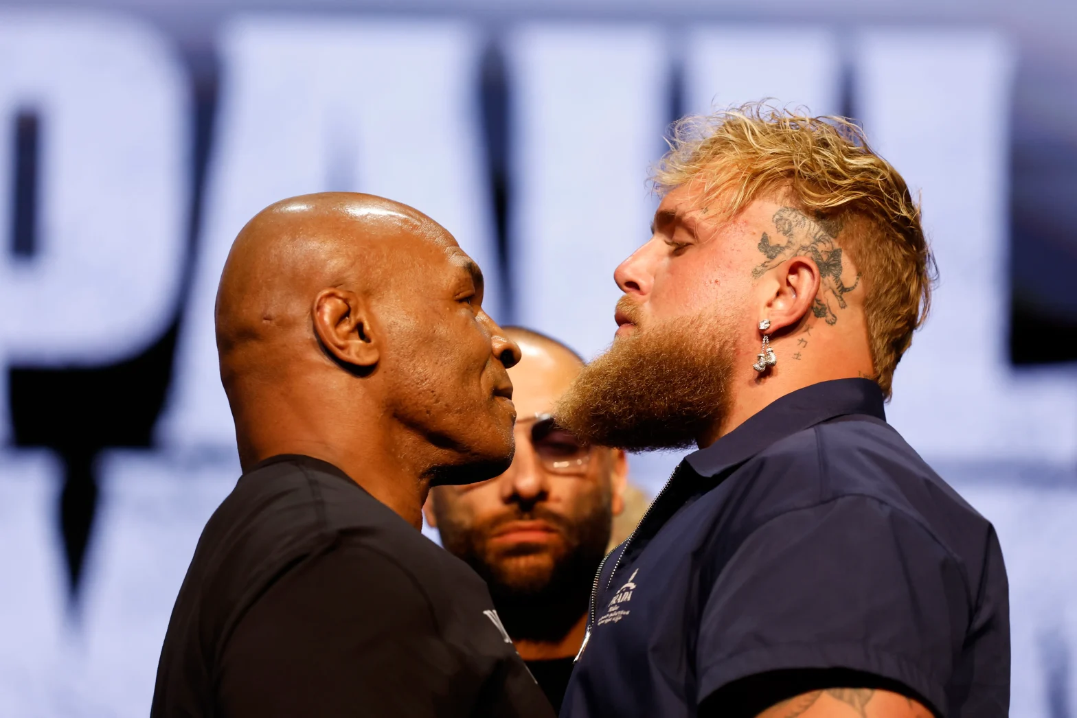 Mike Tyson Faces Jake Paul in Netflix's Live Event Amid Technical Glitches and Showmanship