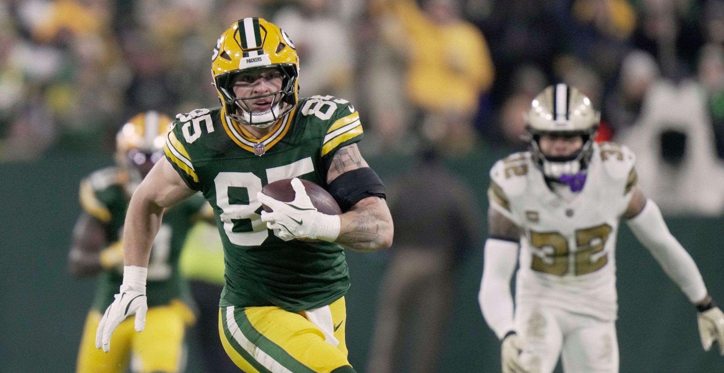 Packers Secure Playoff Spot with 34-0 Win Over Saints but Face Uncertainty After Watson Injury