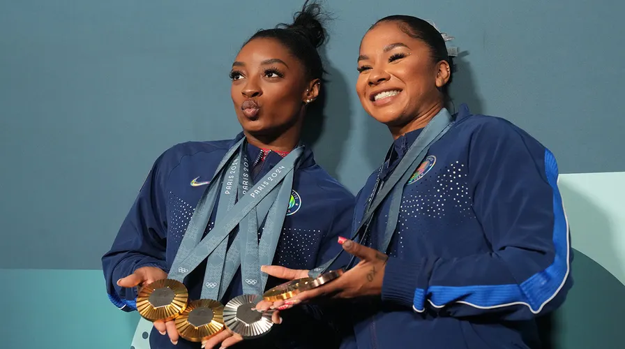 Simone Biles and Suni Lee Secure Olympic All-Around Spots Amid Backlash Over Jordan Chiles' Emotional Reaction