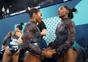 Simone Biles and Suni Lee Secure Olympic All-Around Spots Amid Backlash Over Jordan Chiles' Emotional Reaction