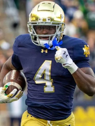 McShay Predicts Titans Will Choose EDGE Rusher Bain Over Running Back Love